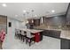 Spacious kitchen with large island, bar seating, stainless steel appliances, and pendant lighting at 6331 Regina Ridge St, Las Vegas, NV 89149