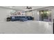 Spacious living room with blue sectional sofa, area rug, and sliding glass doors to the outdoor space at 6331 Regina Ridge St, Las Vegas, NV 89149