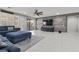 Inviting living room featuring modern decor, stylish furnishings, and a sliding door to the backyard at 6331 Regina Ridge St, Las Vegas, NV 89149