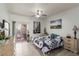 Bright bedroom featuring a ceiling fan, neutral walls, and access to a private balcony at 6480 Annie Oakley Dr # 814, Las Vegas, NV 89120