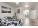Cozy bedroom with tiled floors, neutral colors, and ensuite bathroom access at 6480 Annie Oakley Dr # 814, Las Vegas, NV 89120