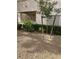 Exterior view of the apartment building surrounded by lush green shrubbery at 6480 Annie Oakley Dr # 814, Las Vegas, NV 89120