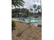 Resort-style pool area with comfortable lounge chairs and swaying palm trees at 6480 Annie Oakley Dr # 814, Las Vegas, NV 89120
