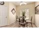 Cozy dining area with tiled floors, a ceiling fan, and a window view at 6480 Annie Oakley Dr # 814, Las Vegas, NV 89120