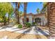 Charming clubhouse nestled among palm trees with well-maintained landscaping and inviting architecture at 6480 Annie Oakley Dr # 814, Las Vegas, NV 89120
