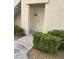 Inviting entryway with a secure white door and well-maintained landscaping at 6480 Annie Oakley Dr # 814, Las Vegas, NV 89120