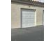 Attached single-car garage with a clean and modern white door at 6480 Annie Oakley Dr # 814, Las Vegas, NV 89120