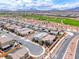 This aerial view shows residences near well-manicured landscapes and roadways in a vibrant community at 669 Assurance Pl, Henderson, NV 89011