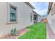 Artificial turf backyard with a patio and a modern exterior at 669 Assurance Pl, Henderson, NV 89011