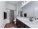 Bathroom featuring a shower-tub combo and dark brown wood flooring at 669 Assurance Pl, Henderson, NV 89011