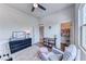 Cozy bedroom features a ceiling fan, plush rug, chair and a walk-in closet at 669 Assurance Pl, Henderson, NV 89011