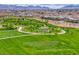 Lush community park with walking paths, open green space, and an amphitheater at 669 Assurance Pl, Henderson, NV 89011