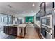 Open kitchen design with a center island, stainless steel appliances, and seamless flow to living spaces at 669 Assurance Pl, Henderson, NV 89011