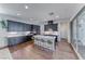 Well-appointed kitchen with a central island, modern appliances, and seamless indoor-outdoor flow at 669 Assurance Pl, Henderson, NV 89011