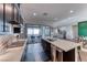 Contemporary kitchen featuring sleek countertops, ample cabinet space, and patio access at 669 Assurance Pl, Henderson, NV 89011