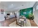 Bright living and dining area featuring hardwood floors and contemporary decor at 669 Assurance Pl, Henderson, NV 89011