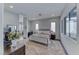 Inviting main bedroom featuring a cozy bed, ample natural light, and a comfortable seating area at 669 Assurance Pl, Henderson, NV 89011