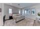 Spacious main bedroom featuring neutral colors, plush carpeting, and generous natural light at 669 Assurance Pl, Henderson, NV 89011