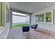 Covered outdoor patio with stylish seating and beautiful brick floor at 669 Assurance Pl, Henderson, NV 89011
