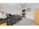 Well-lit bedroom with carpet, ceiling fan, and furniture creating a comfortable retreat at 7058 W Camero Ave, Las Vegas, NV 89113