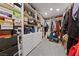 Organized walk-in closet with custom shelving, drawers, and ample storage space for clothes and accessories at 7058 W Camero Ave, Las Vegas, NV 89113