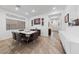 Bright dining room featuring stylish decor, modern lighting, and sleek furniture at 7058 W Camero Ave, Las Vegas, NV 89113