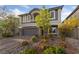Charming two-story home featuring a well-manicured front yard and a spacious two-car garage at 7058 W Camero Ave, Las Vegas, NV 89113