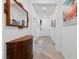 Bright hallway features beautiful wood floors, elegant decor, and a welcoming atmosphere at 7058 W Camero Ave, Las Vegas, NV 89113