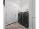 Laundry room features side-by-side washer and dryer at 7058 W Camero Ave, Las Vegas, NV 89113