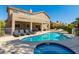 Inviting backyard pool and spa with lounge chairs and covered patio, perfect for outdoor entertaining at 723 Seclusion Glen Ave, Las Vegas, NV 89123