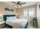 This beautifully lit bedroom has a comfortable bed, stylish chair and light filtering window shutters at 723 Seclusion Glen Ave, Las Vegas, NV 89123
