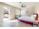 Bedroom featuring a pink bed, sliding glass door to balcony, and ample natural light at 723 Seclusion Glen Ave, Las Vegas, NV 89123