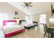 Bright bedroom with multiple beds, wood-look floors, ceiling fan and modern decor at 723 Seclusion Glen Ave, Las Vegas, NV 89123