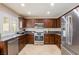 Updated kitchen featuring stainless steel appliances, granite countertops, and ample cabinetry at 723 Seclusion Glen Ave, Las Vegas, NV 89123