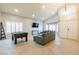 Spacious living room featuring a pool table, gray sofa, tile floors, and recessed lighting at 723 Seclusion Glen Ave, Las Vegas, NV 89123