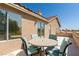 This outdoor patio features plenty of seating with desert views, perfect for relaxing with friends at 723 Seclusion Glen Ave, Las Vegas, NV 89123