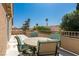 This outdoor patio features a tiled table with desert views, perfect for relaxing with friends at 723 Seclusion Glen Ave, Las Vegas, NV 89123