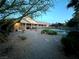 Picturesque backyard with a fountain, pool, and covered patio perfect for outdoor relaxation and entertaining at 7451 Mystic Stream St, Las Vegas, NV 89131