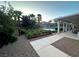 Lush backyard garden with blooming flowers and gravel pathway offers a serene outdoor space at 7451 Mystic Stream St, Las Vegas, NV 89131