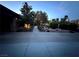 Long driveway leading to a charming home with attached garage and covered parking at 7451 Mystic Stream St, Las Vegas, NV 89131
