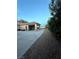 Long driveway leading to the attached garage with covered parking at 7451 Mystic Stream St, Las Vegas, NV 89131