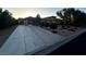 Expansive driveway leading to a three-car garage, complemented by mature landscaping and a well-maintained exterior at 7451 Mystic Stream St, Las Vegas, NV 89131