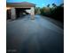 Driveway with covered parking leading to the attached garage at 7451 Mystic Stream St, Las Vegas, NV 89131