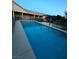 Inviting swimming pool offers refreshing relaxation and recreation, surrounded by a secured safety fence at 7451 Mystic Stream St, Las Vegas, NV 89131