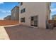 Spacious blank canvas backyard offers a fenced boundary, a sliding glass door to home, ready for your custom design at 7482 Lodano Ave, Las Vegas, NV 89113