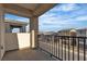 Enjoy neighborhood views from this home's cozy balcony space with a metal safety railing at 7482 Lodano Ave, Las Vegas, NV 89113