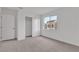 Bright bedroom featuring carpet floors, a window, and a closet, providing a tranquil living space at 7482 Lodano Ave, Las Vegas, NV 89113