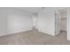 An empty carpeted bedroom features neutral paint and multiple doors at 7482 Lodano Ave, Las Vegas, NV 89113
