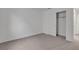 Comfortable bedroom offering neutral carpet, fresh walls, and a closet for storage at 7482 Lodano Ave, Las Vegas, NV 89113