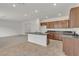 Elegant kitchen with granite countertops, tile flooring, and a functional center island at 7482 Lodano Ave, Las Vegas, NV 89113
